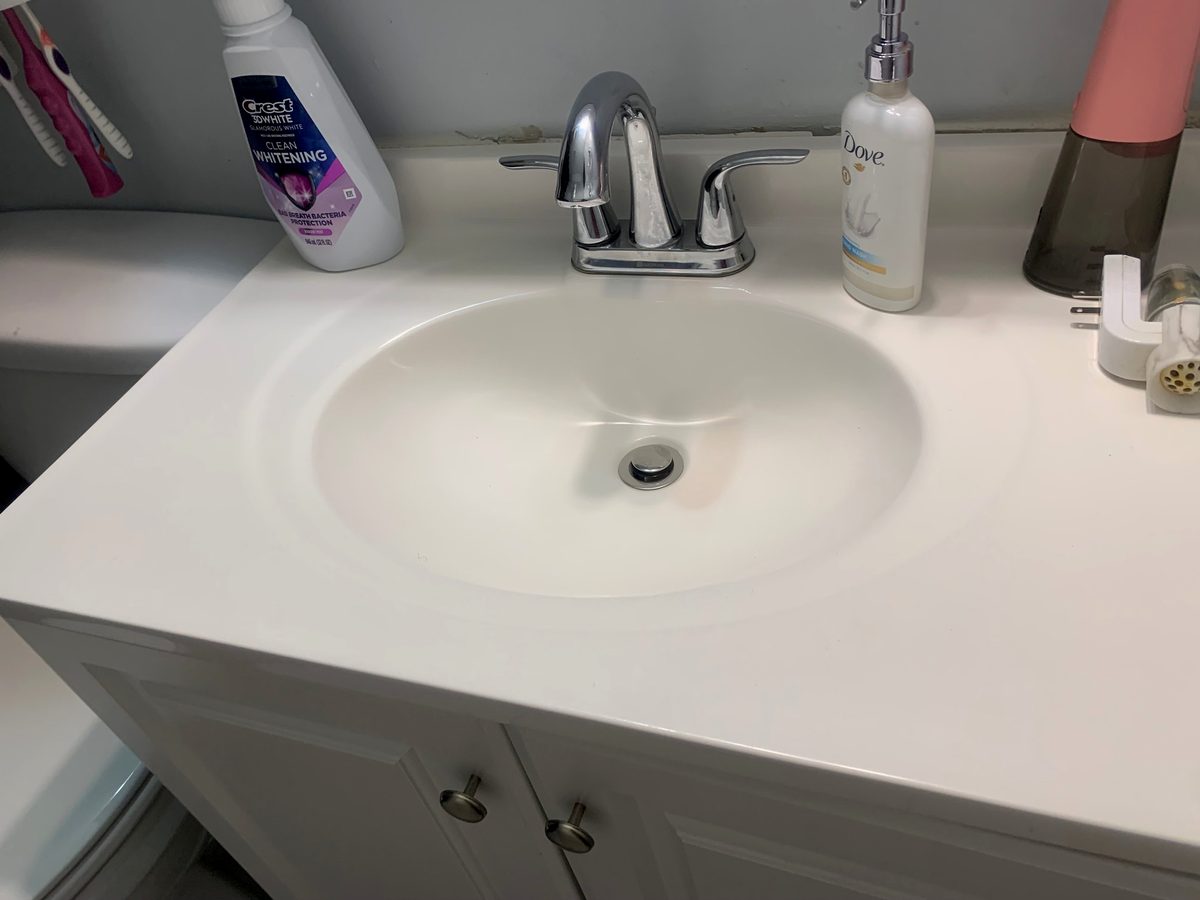Spotless bathroom sink and vanity cleaned by Sleec Cleaning Services