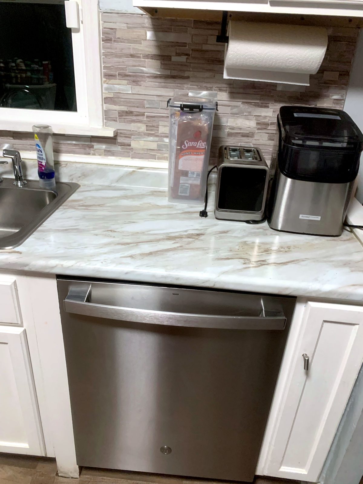 Sink & dishwasher area after cleaning by Sleec Cleaning Services in St. Louis