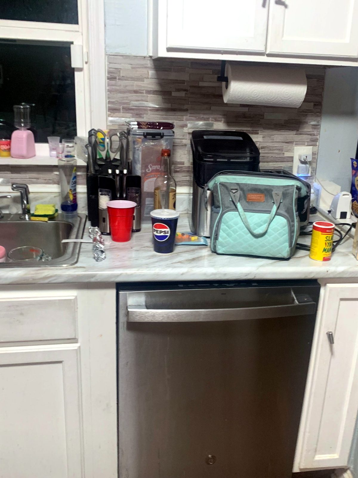 Sink & dishwasher area before cleaning by Sleec Cleaning Services in St. Louis